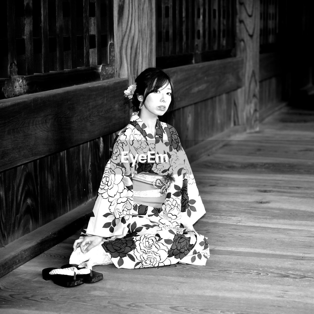 Portrait of woman sitting outdoors