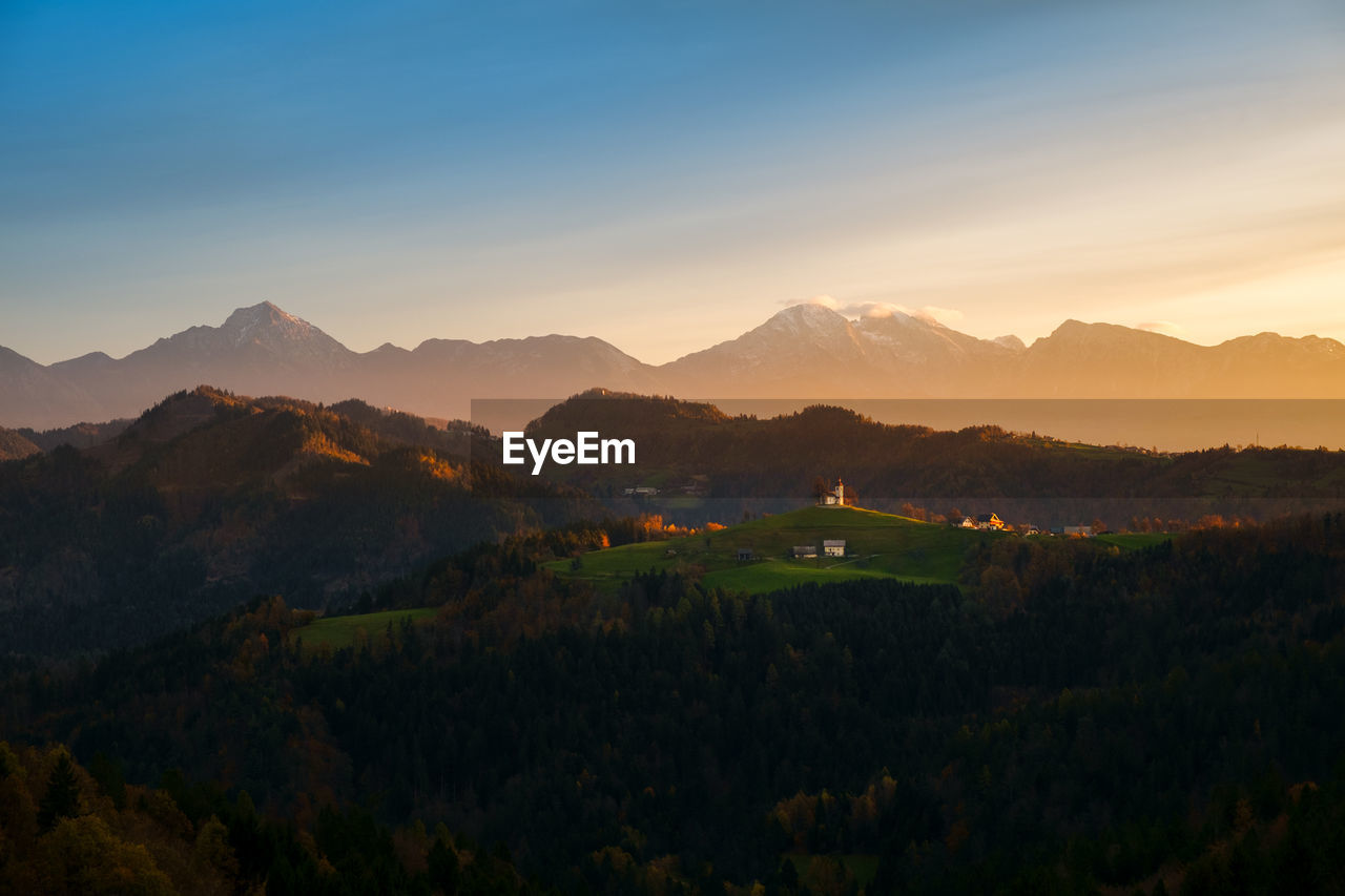 Scenic view of mountains against sky during sunset