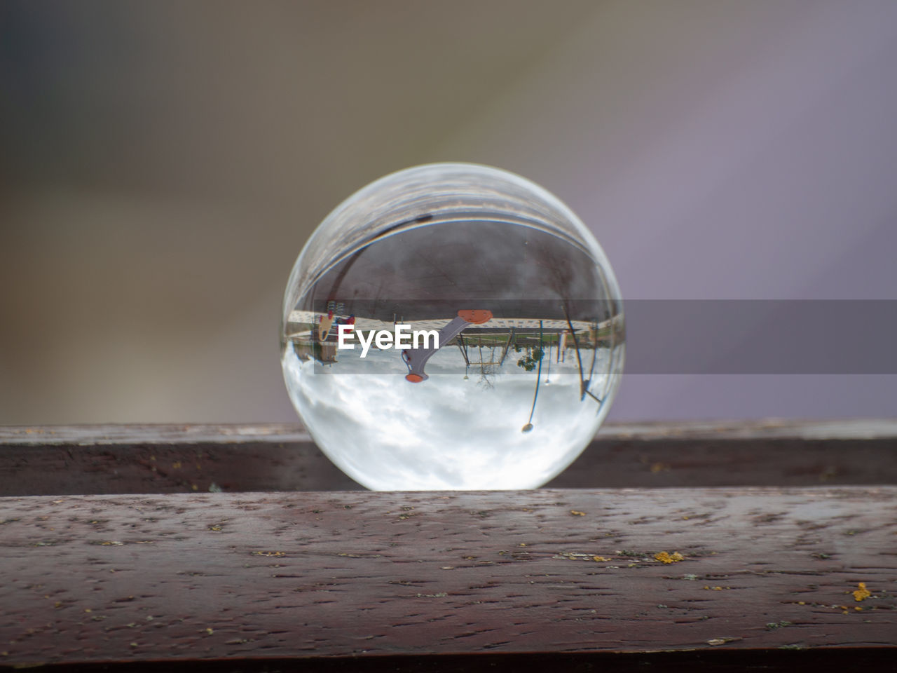 CLOSE-UP OF CRYSTAL BALL ON GLASS