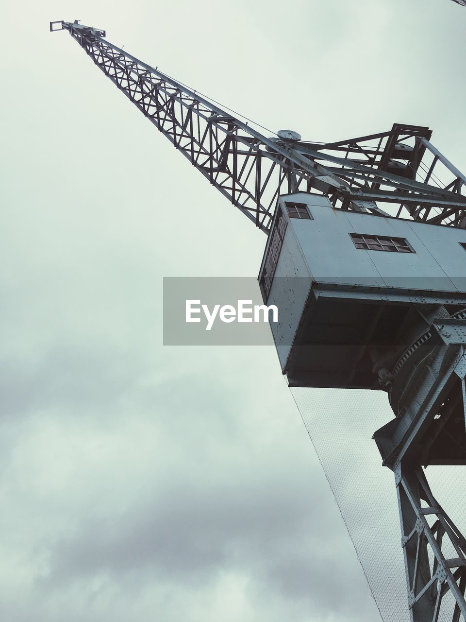 LOW ANGLE VIEW OF METALLIC STRUCTURE AGAINST SKY