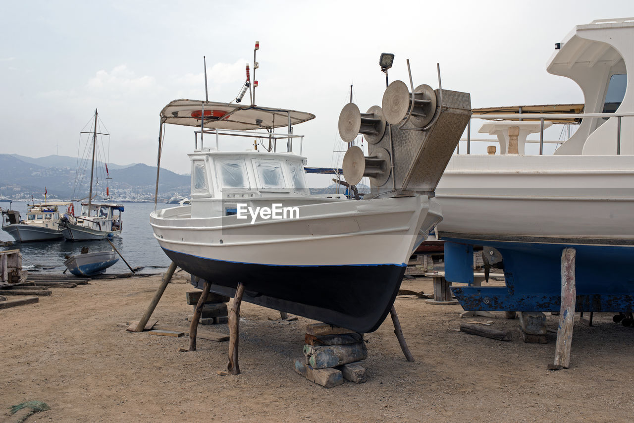 A wooden boat on the lift in a shipyard in bodrum, turkey