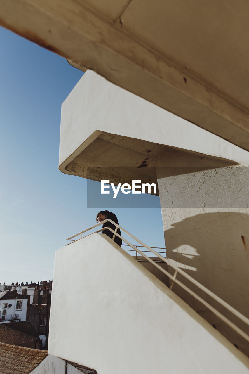 LOW ANGLE VIEW OF BUILDINGS AGAINST CLEAR SKY