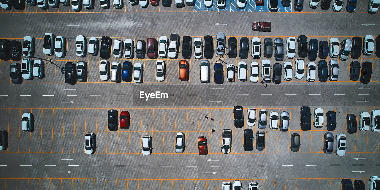 Parking lot. parked vehicles. aerial view of cars parked on outdoor asphalt parking lot