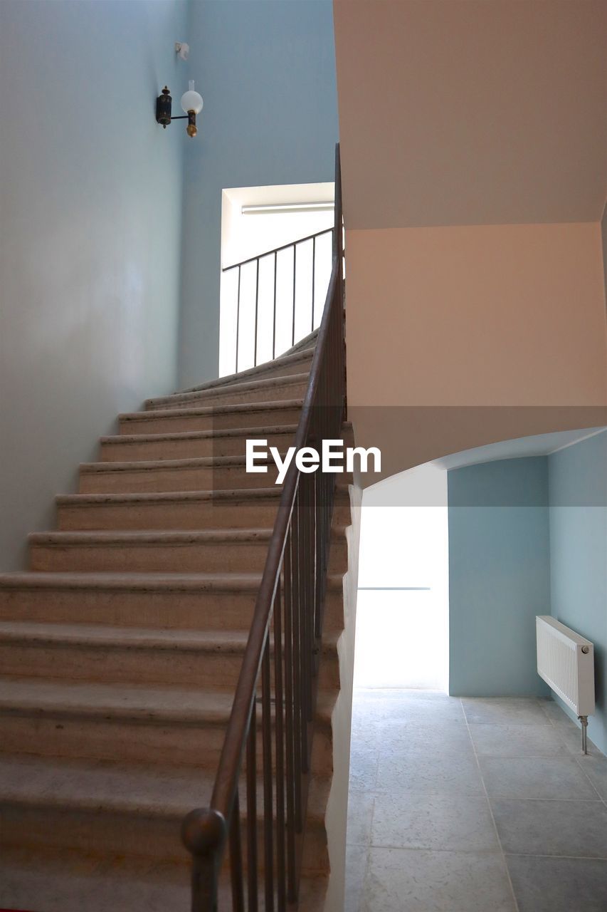 LOW ANGLE VIEW OF STAIRCASE AND BUILDING