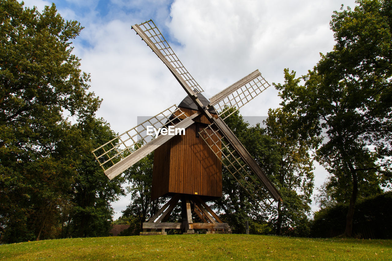 windmill, environmental conservation, mill, renewable energy, alternative energy, power generation, plant, wind turbine, environment, wind power, turbine, sky, nature, tree, building, traditional windmill, architecture, rural scene, grass, landscape, cloud, built structure, rural area, day, no people, outdoors, field, agriculture, green, land, low angle view