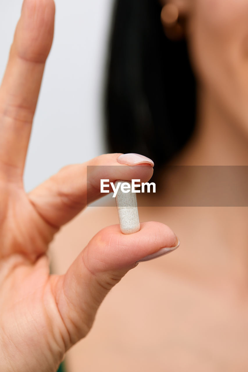 cropped hand of woman holding ice cream