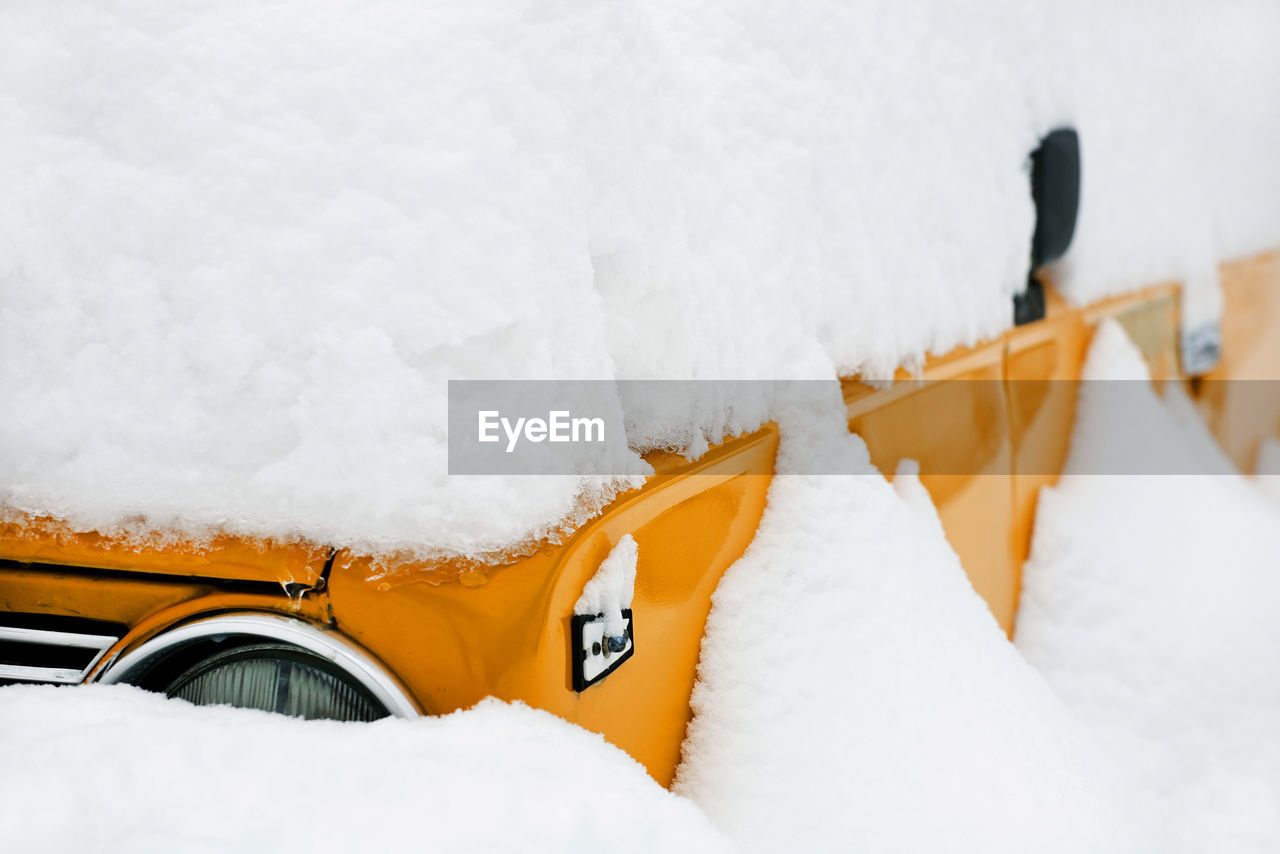 Close-up of snow covered vehicle