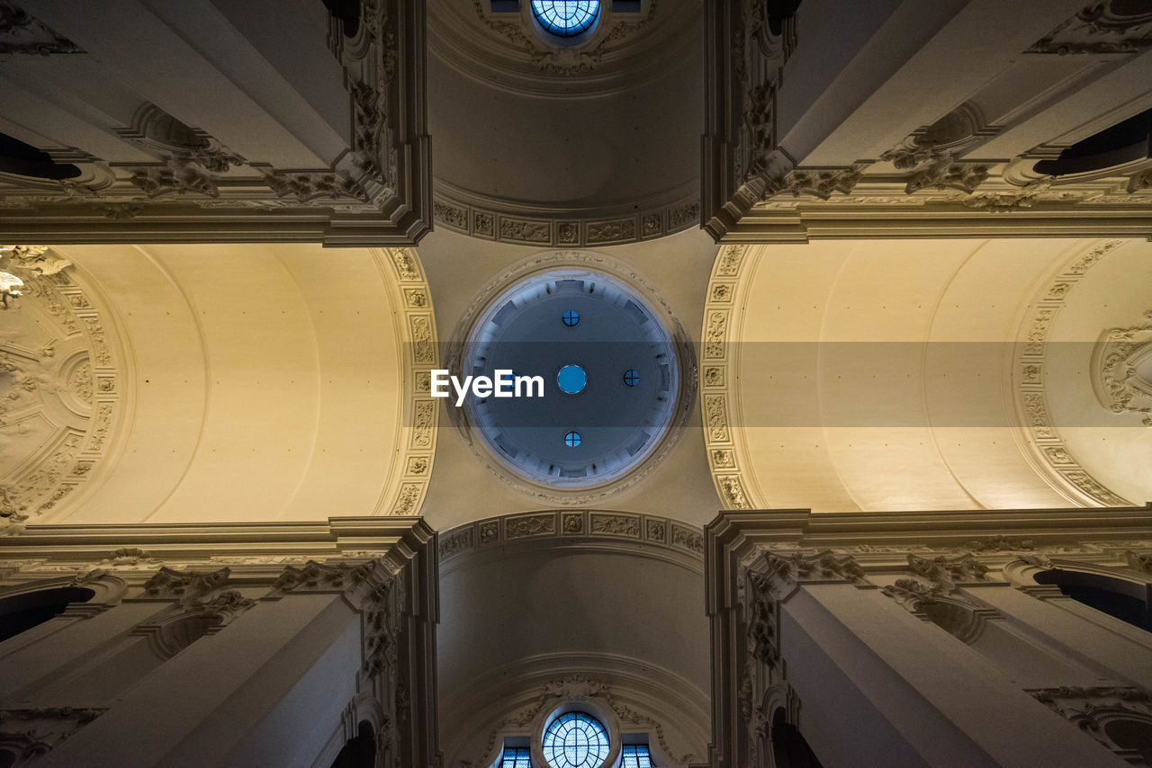 LOW ANGLE VIEW OF CEILING AND BUILDING