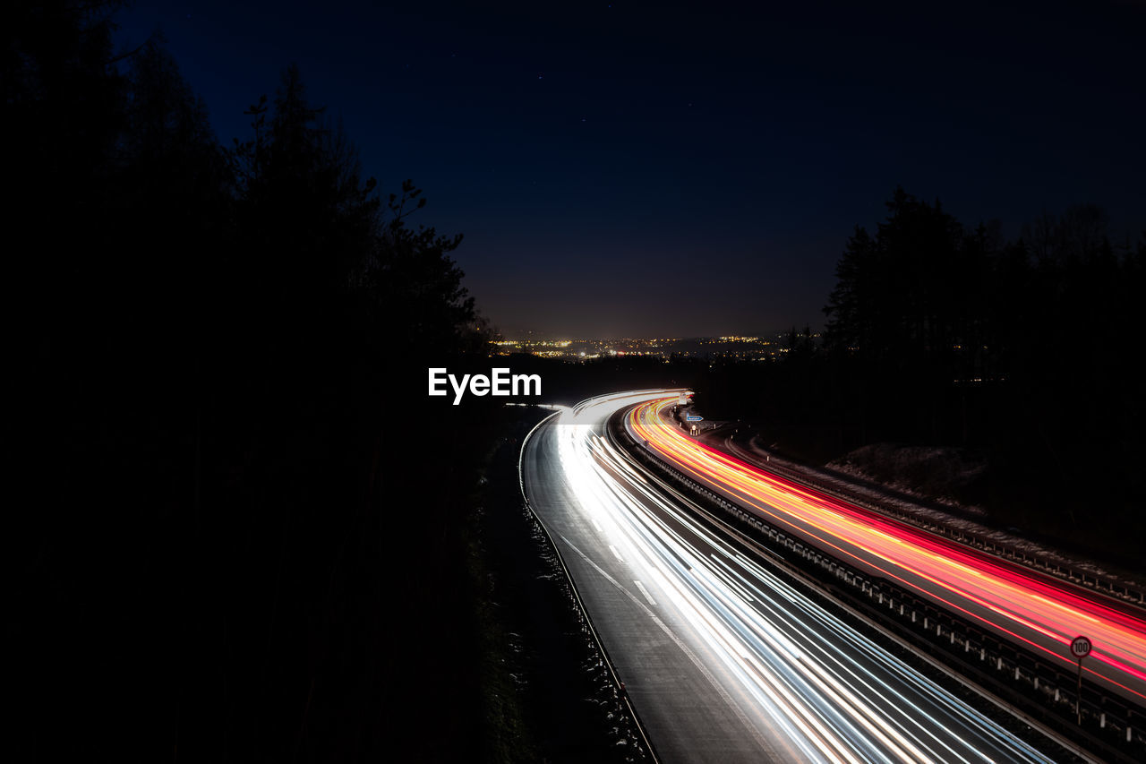 Light trails on road at night