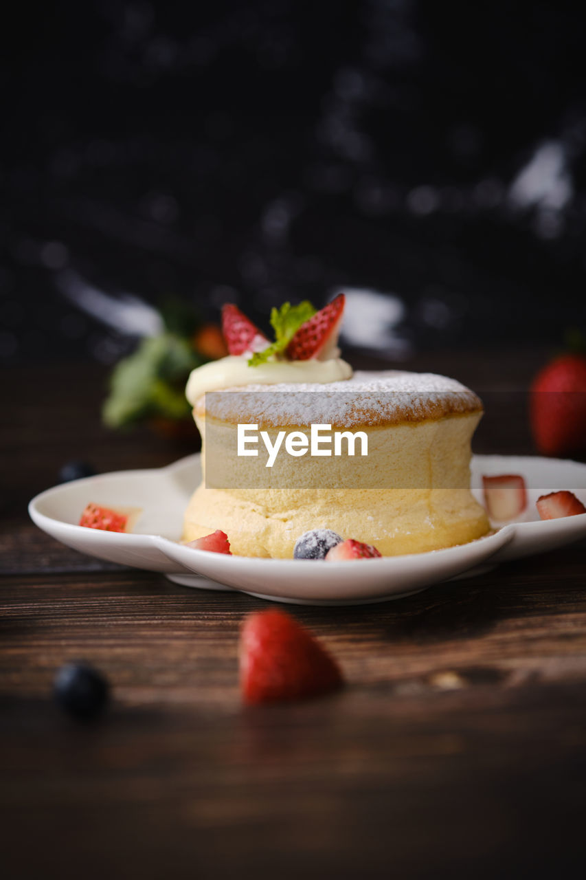 CLOSE-UP OF CAKE WITH ICE CREAM