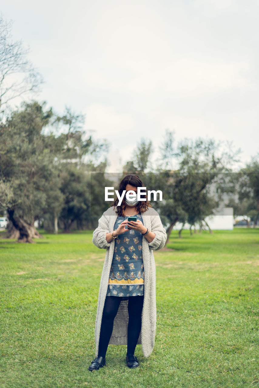 Full length of woman standing on field