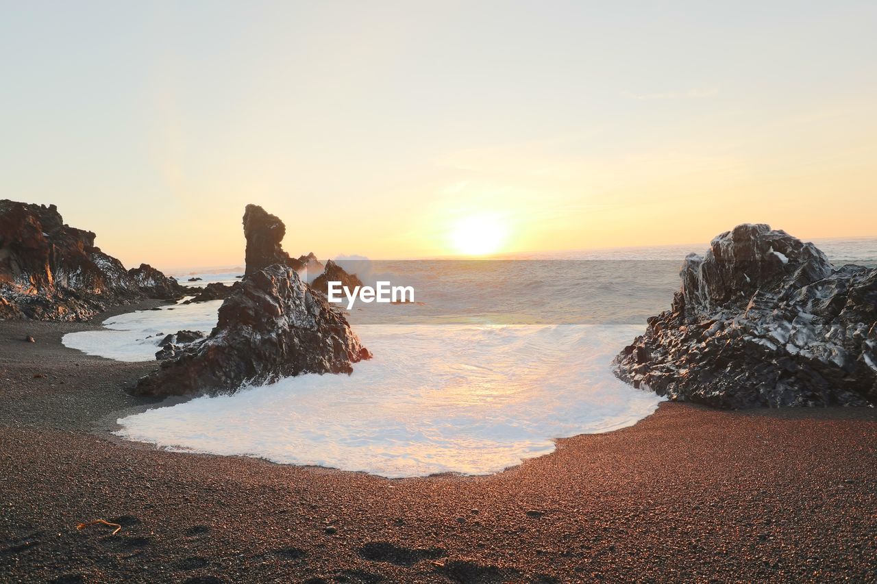 Scenic view of sea against sky during sunset