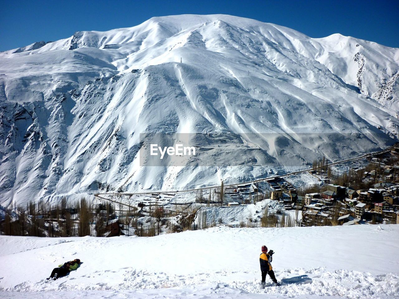 People against snowcapped mountains