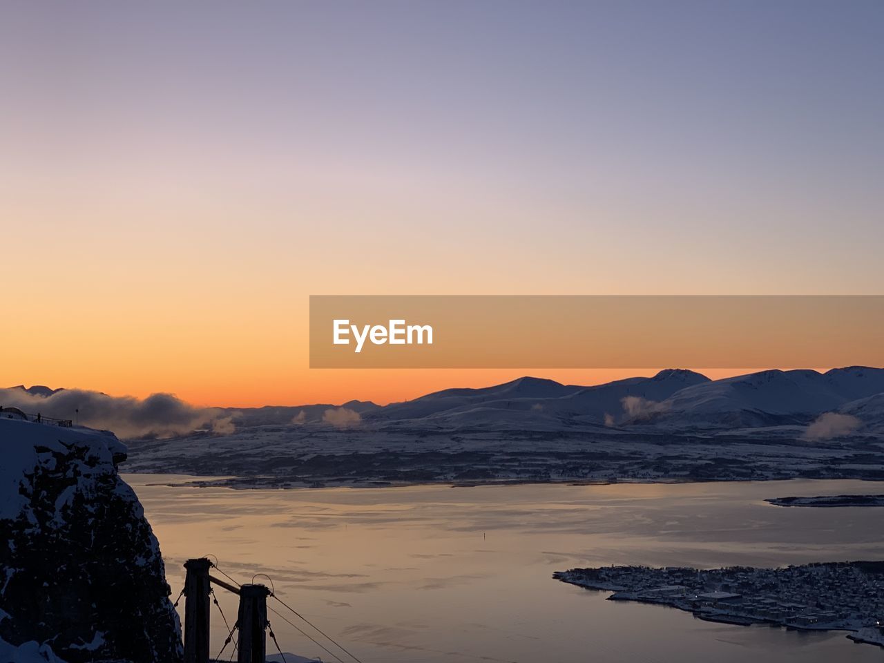 Scenic view of sea against clear sky during sunset