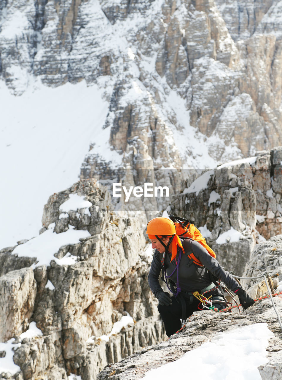 HIGH ANGLE VIEW OF MAN ON ROCK