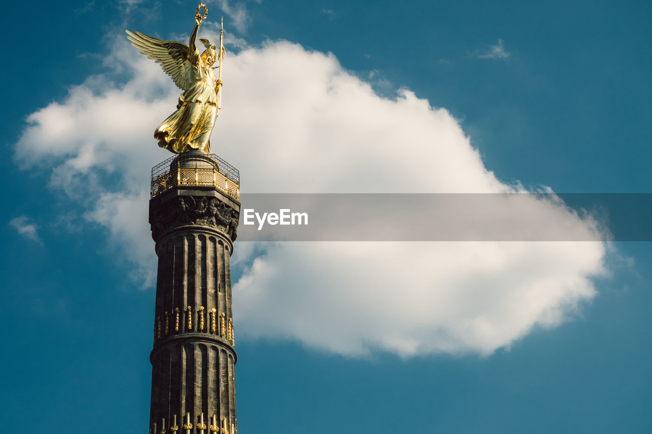 Low angle view of berlin victory column against sky