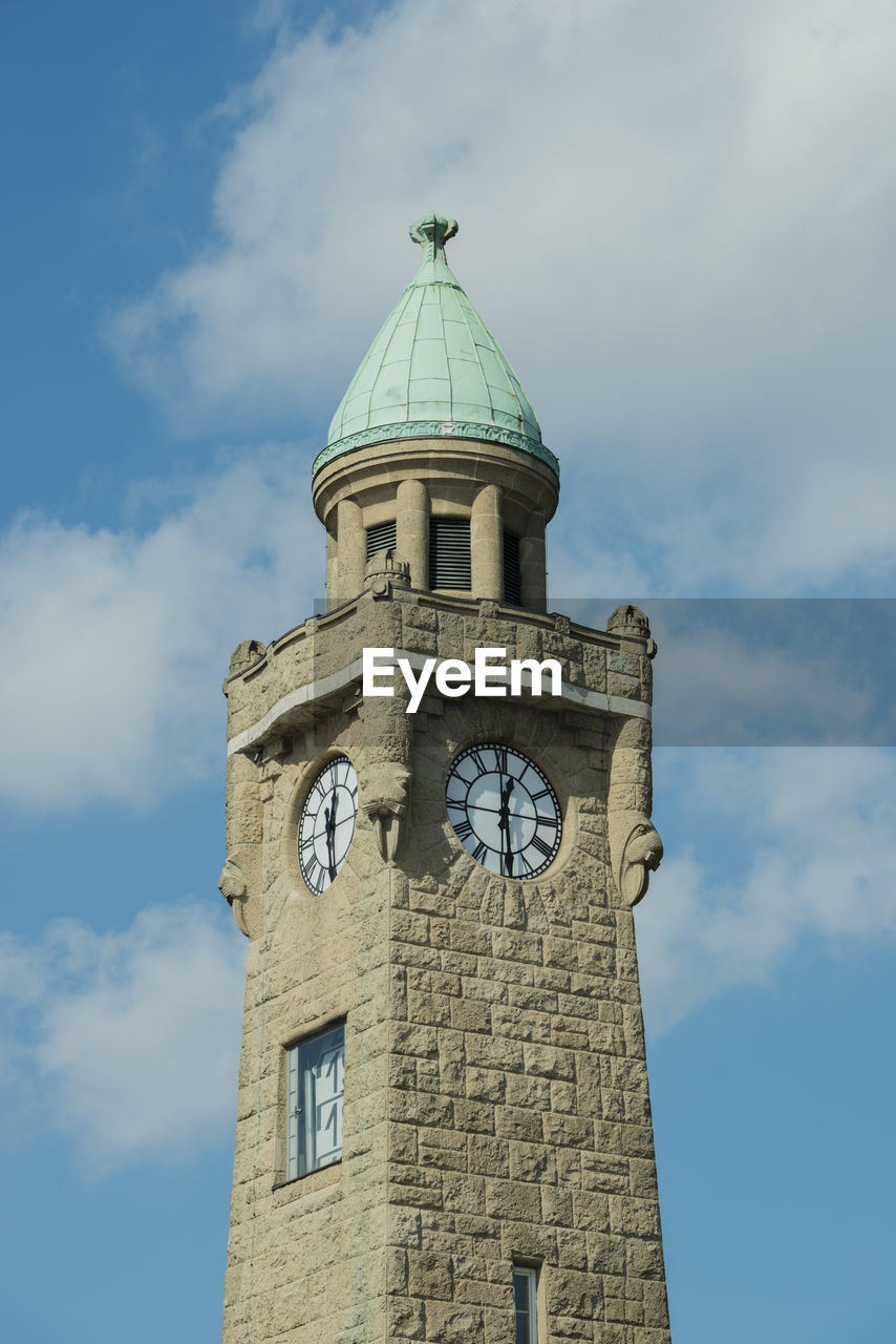 Low angle view of clock tower against sky