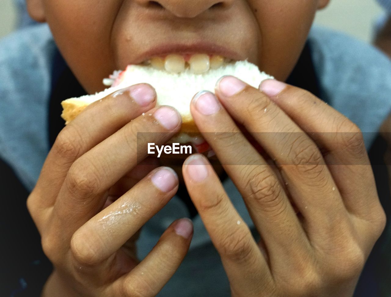 Close-up of boy eating food