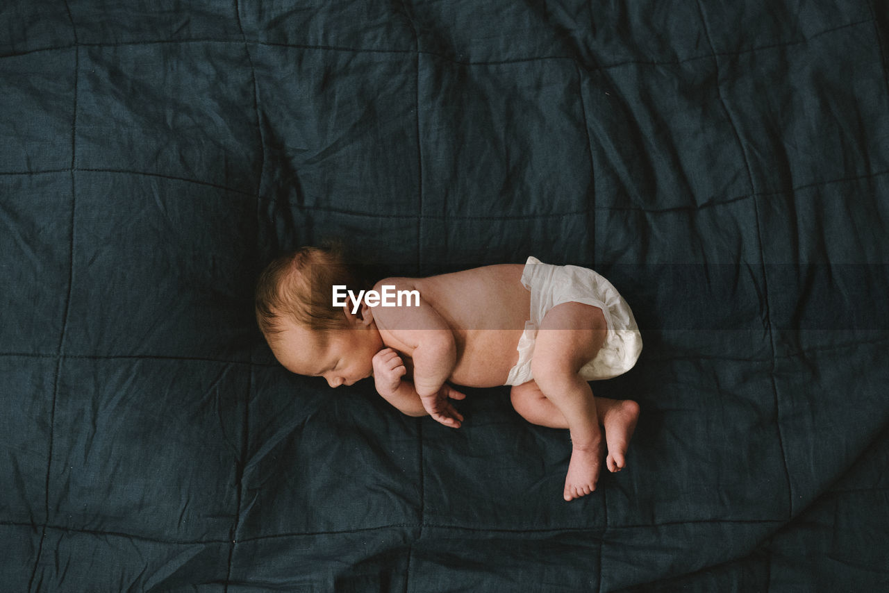 High angle view of baby sleeping