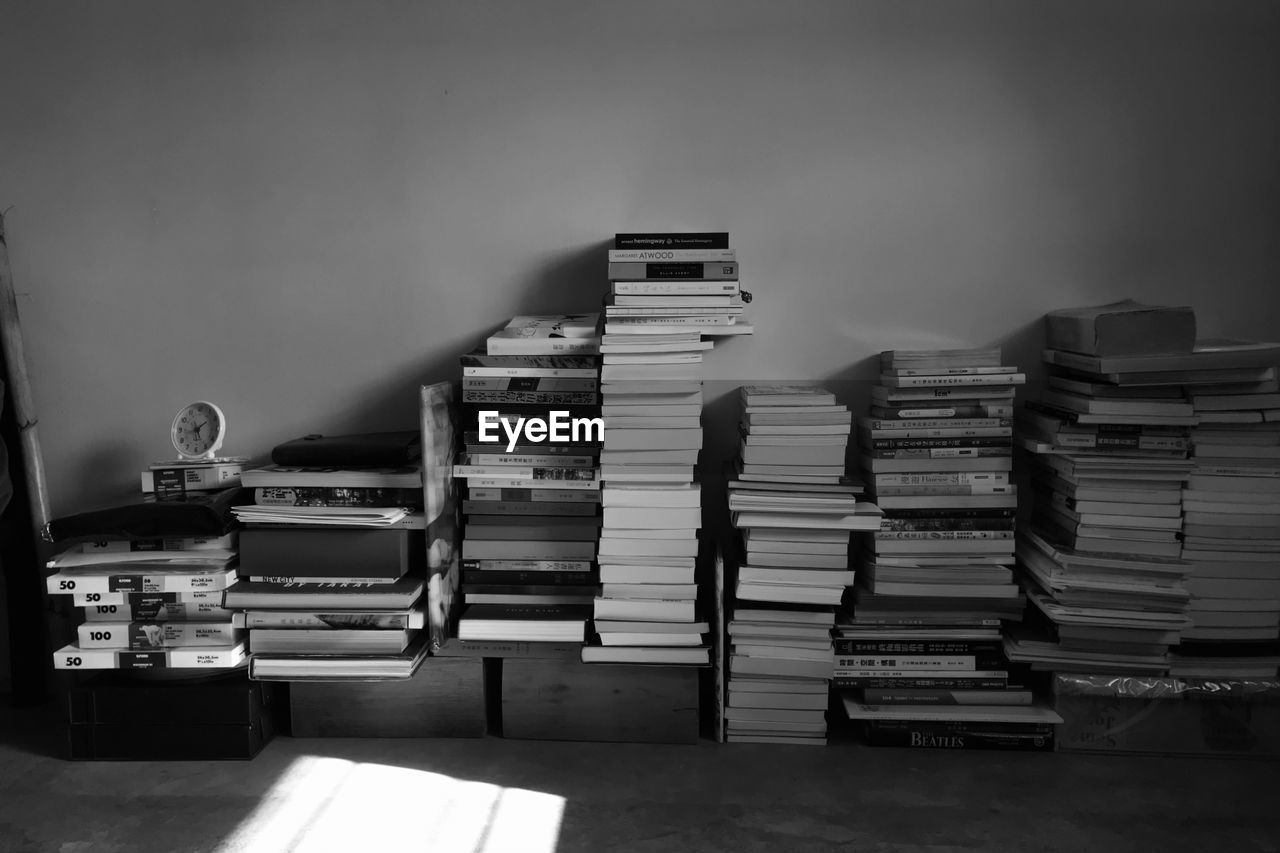 white, black, black and white, large group of objects, book, publication, monochrome, indoors, monochrome photography, no people, education, table, bookcase, abundance, furniture, shelf, arrangement, order