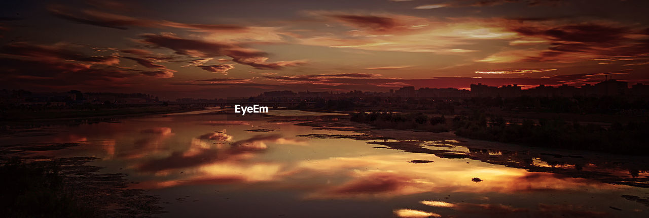 VIEW OF CALM SEA AGAINST CLOUDY SKY