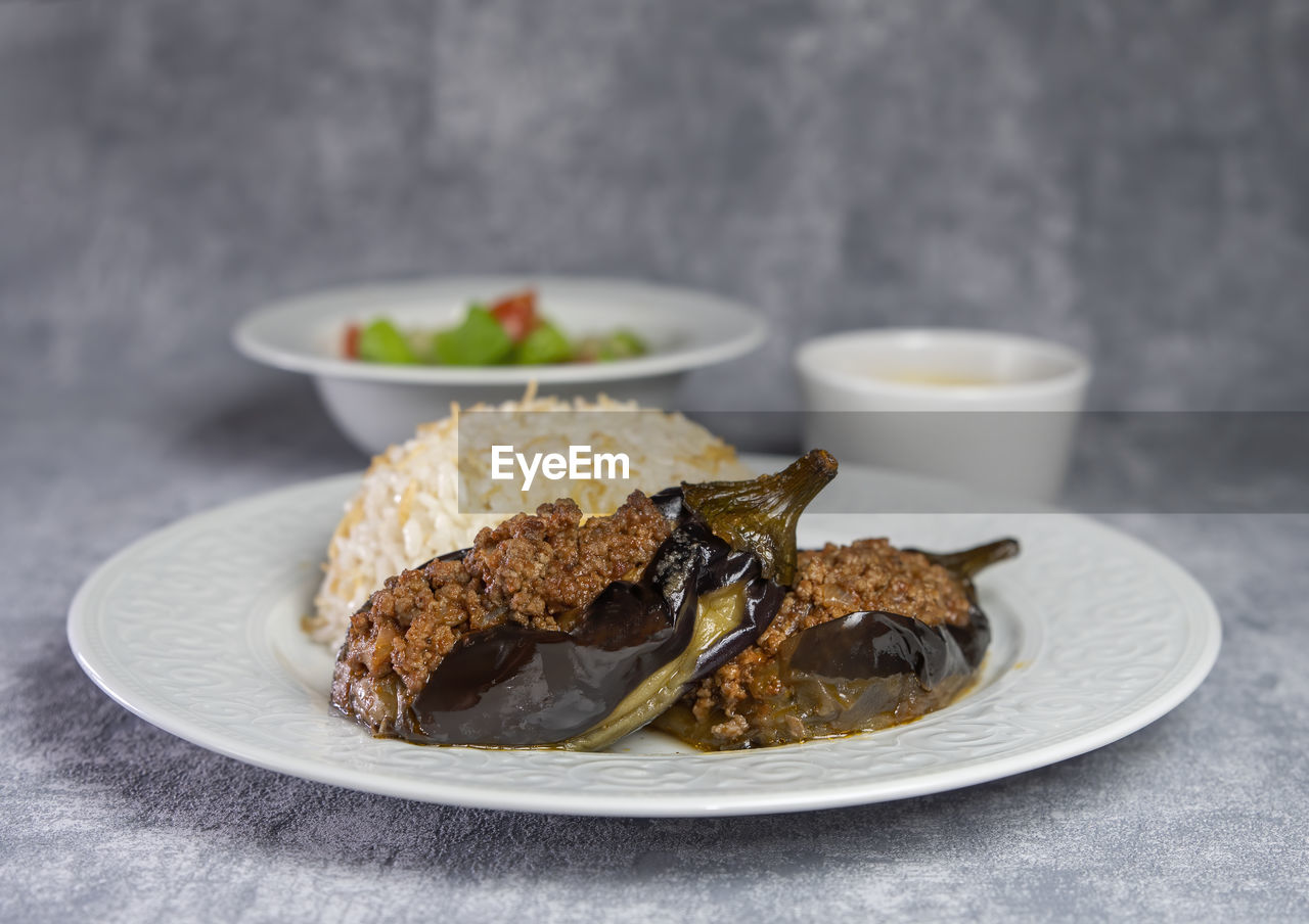 Close-up of food in plate on table.karniarek is a dish found in turkey 