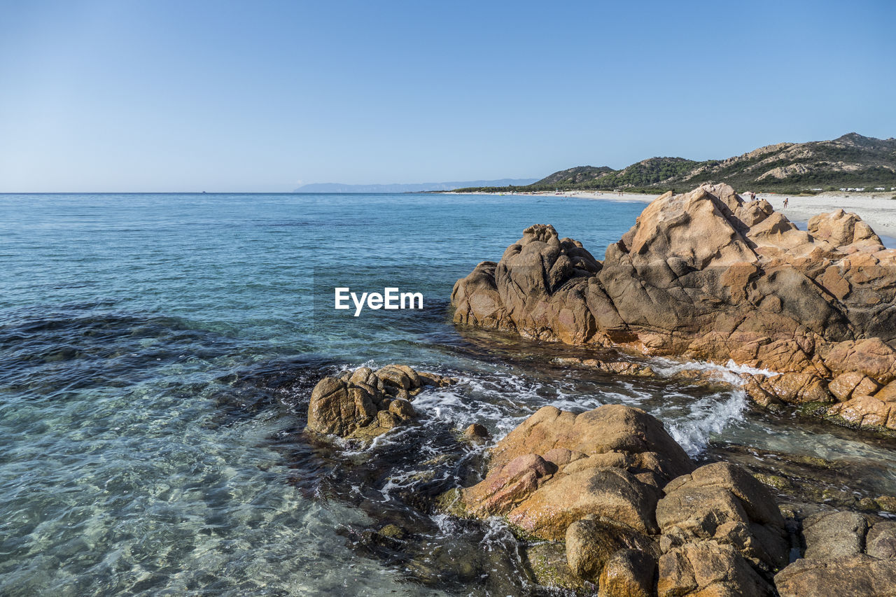 The beach of cala brandinchi with red rocks in, siniscola, sardinia