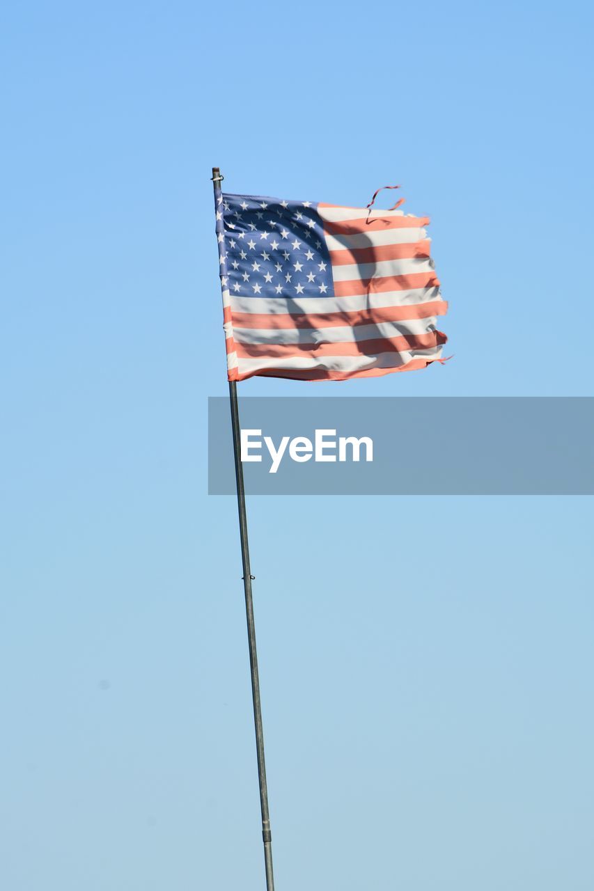 American flag against clear blue sky