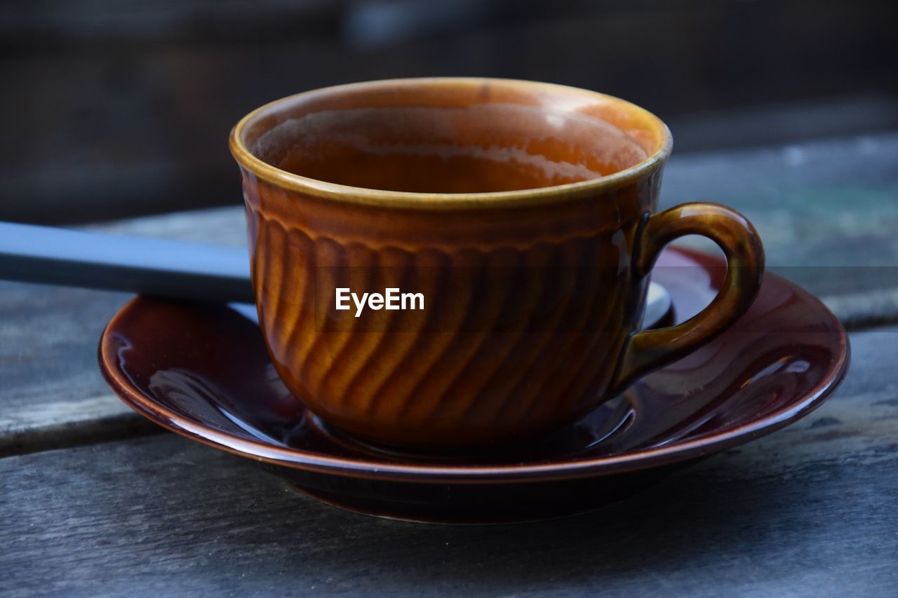 High angle view of coffee cup on table