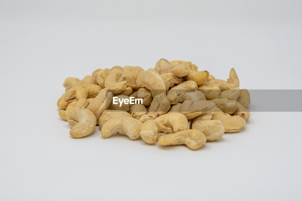 CLOSE-UP OF SWEET FOOD AGAINST WHITE BACKGROUND