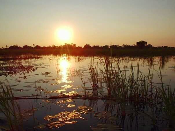 SCENIC VIEW OF SUNSET OVER LAKE