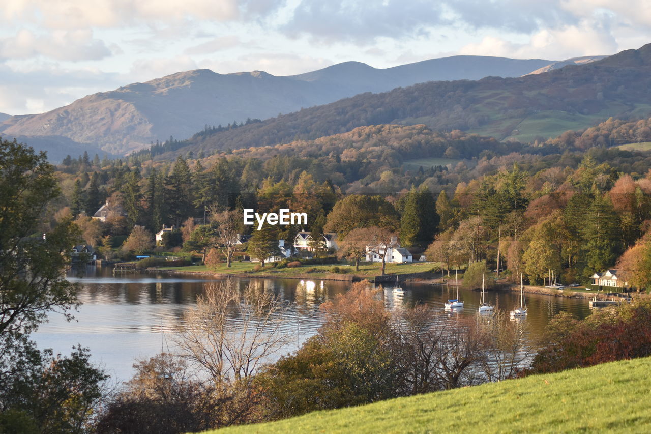 Scenic view of lake and mountains against sky