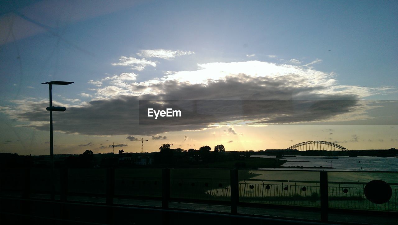 VIEW OF CLOUDY SKY AT SUNSET