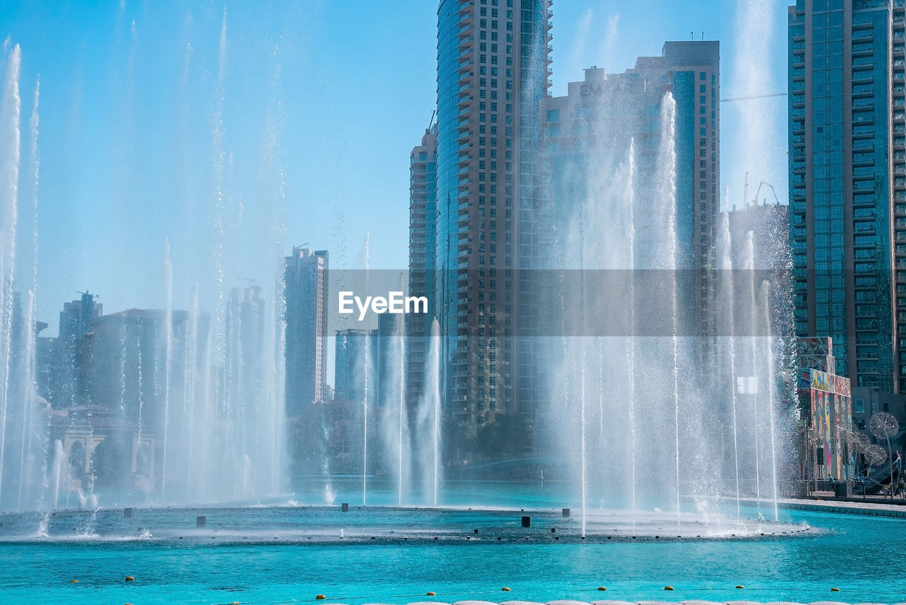 The dancing fountains near burj khalifa skyscraper in dubai.