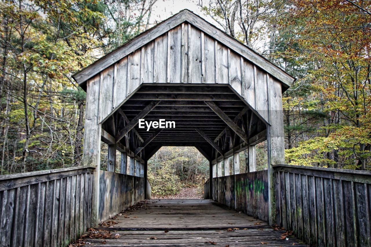 Low angle view of walkway leading to bridge