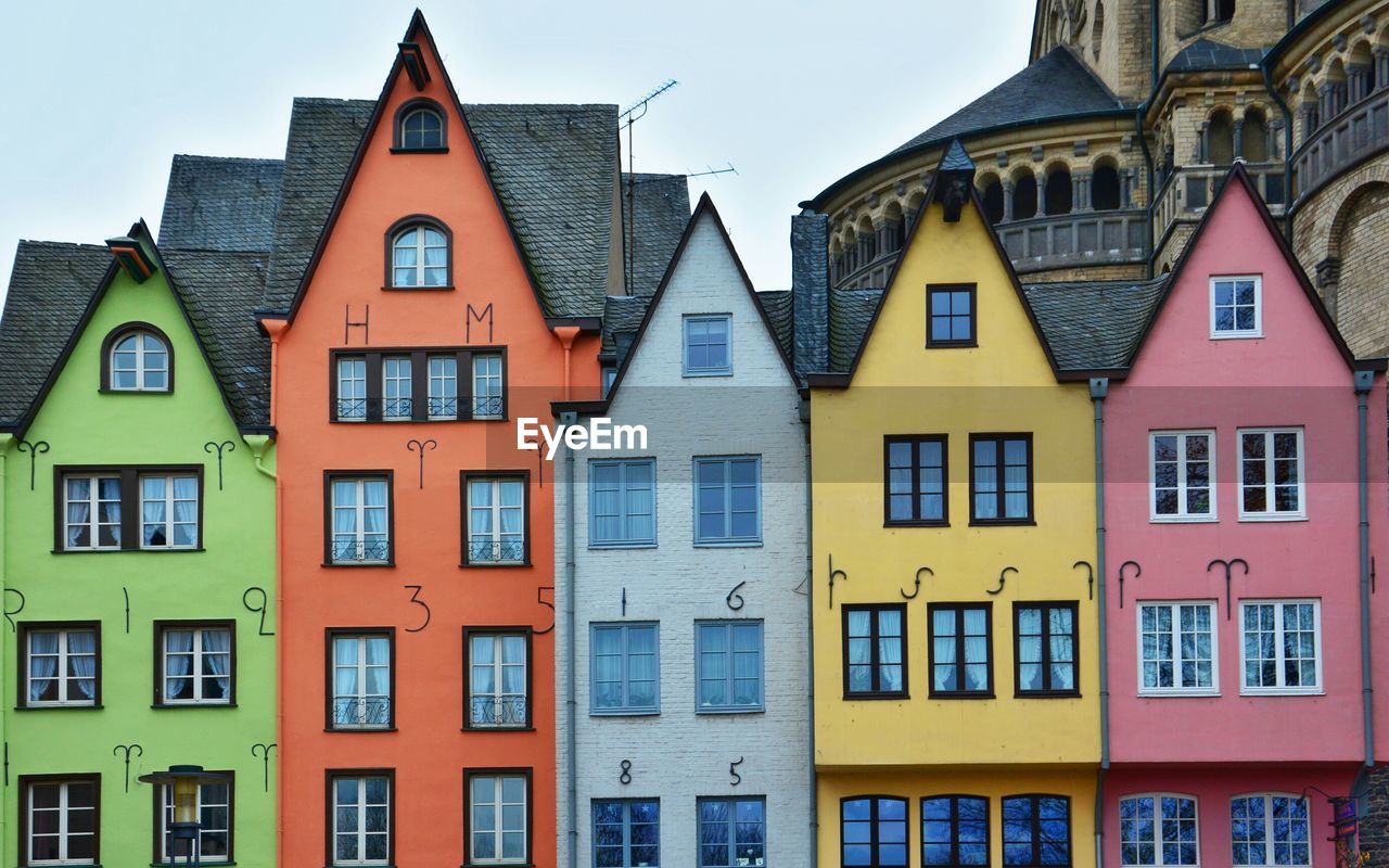 Buildings in town against sky