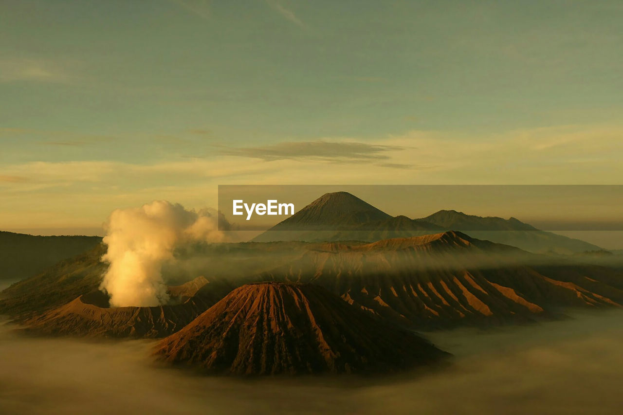 Panoramic view of volcanic landscape against sky during sunset