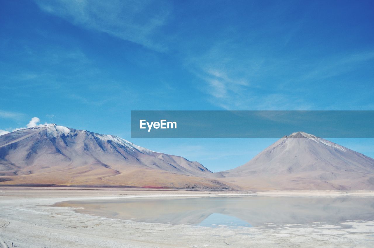 Tranquil sunny landscape against blue sky