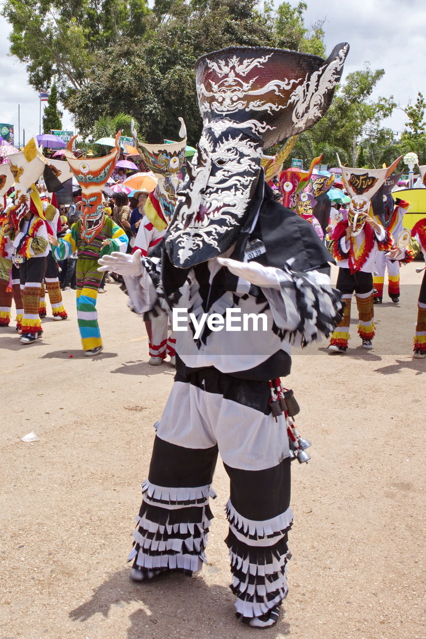 People dressed in costume at phi ta khon festival