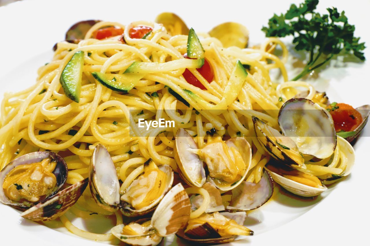 Close up front view dilicious spaghetti vongole, typical tasty italian cuisine-dish.