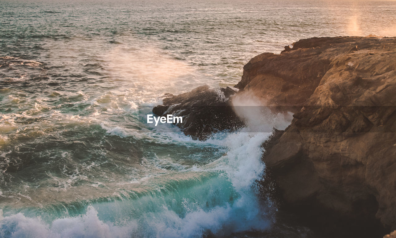 High angle view of waves in sea against sky