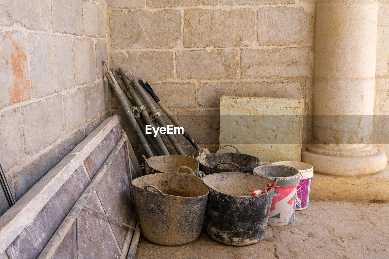 wall - building feature, wall, wood, architecture, container, no people, bucket, broom, built structure, day, outdoors, old, floor