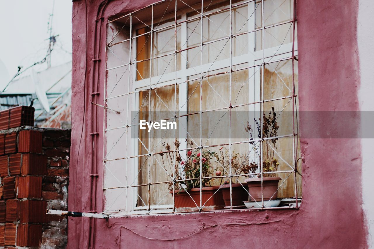 Abandoned building seen through broken window