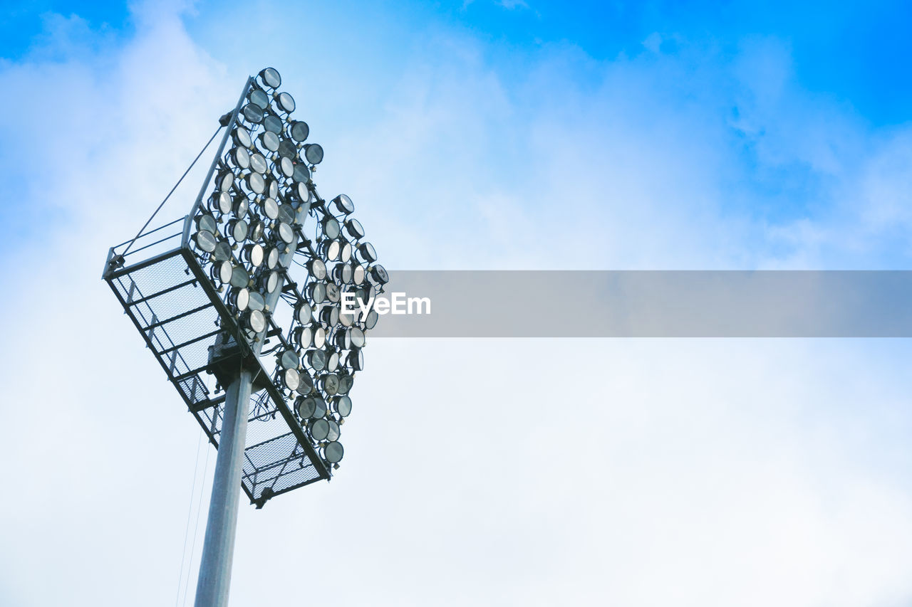 Low angle view of floodlight against sky