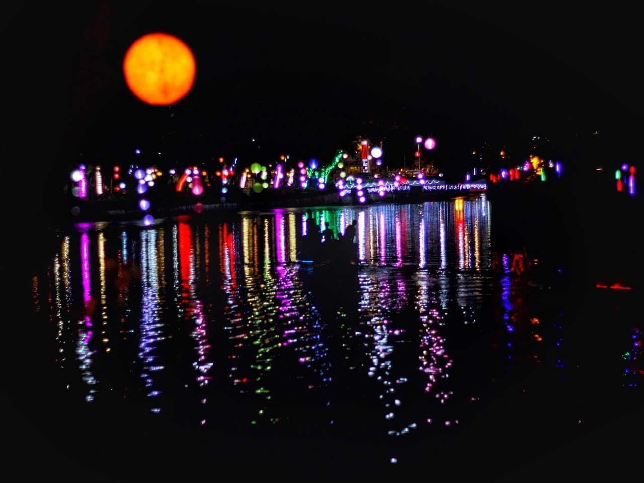 Illuminated colorful lanterns during festival kalimas at night