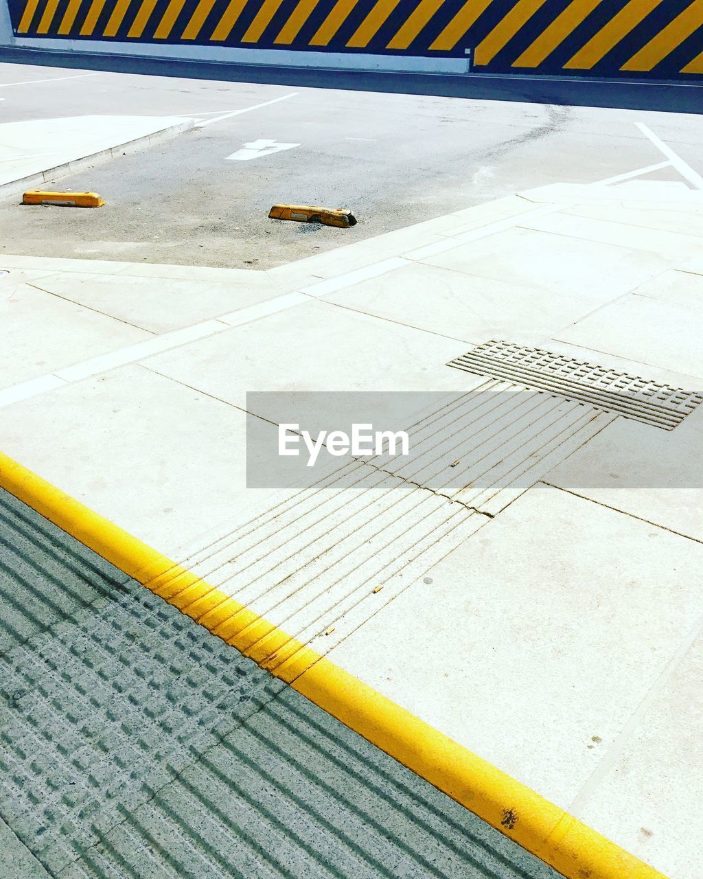 CLOSE-UP OF AIRPLANE ON RUNWAY AT AIRPORT