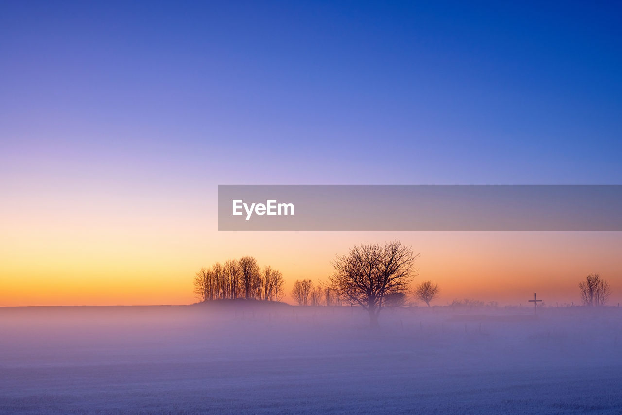 Misty sunrise in cold weather at a scenic landscape view