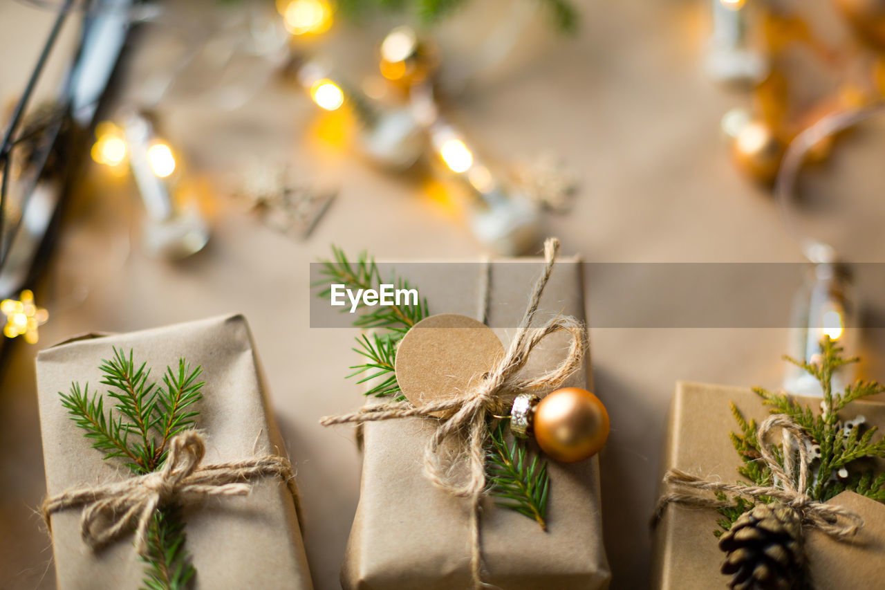 HIGH ANGLE VIEW OF CHRISTMAS DECORATIONS ON TABLE