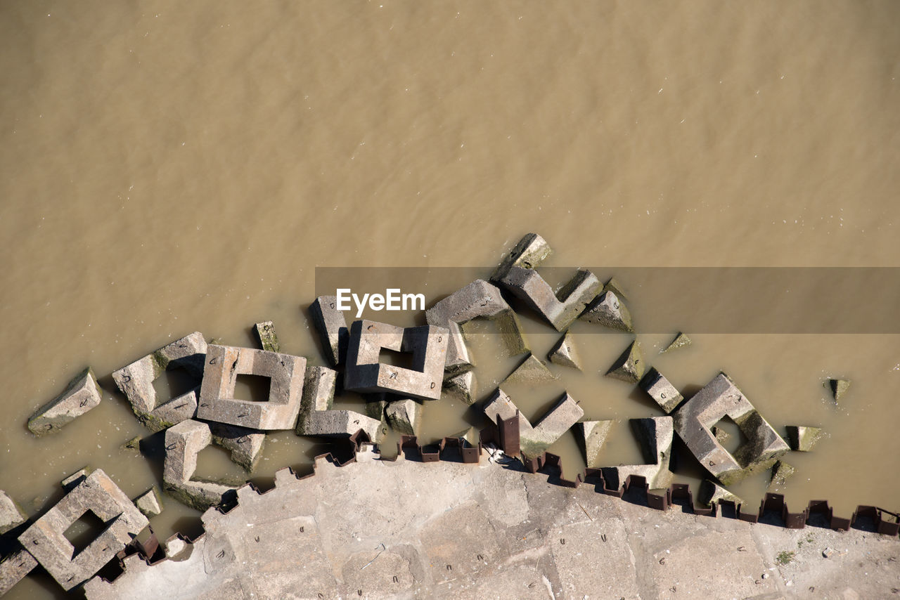 HIGH ANGLE VIEW OF BUILT STRUCTURES AT BEACH