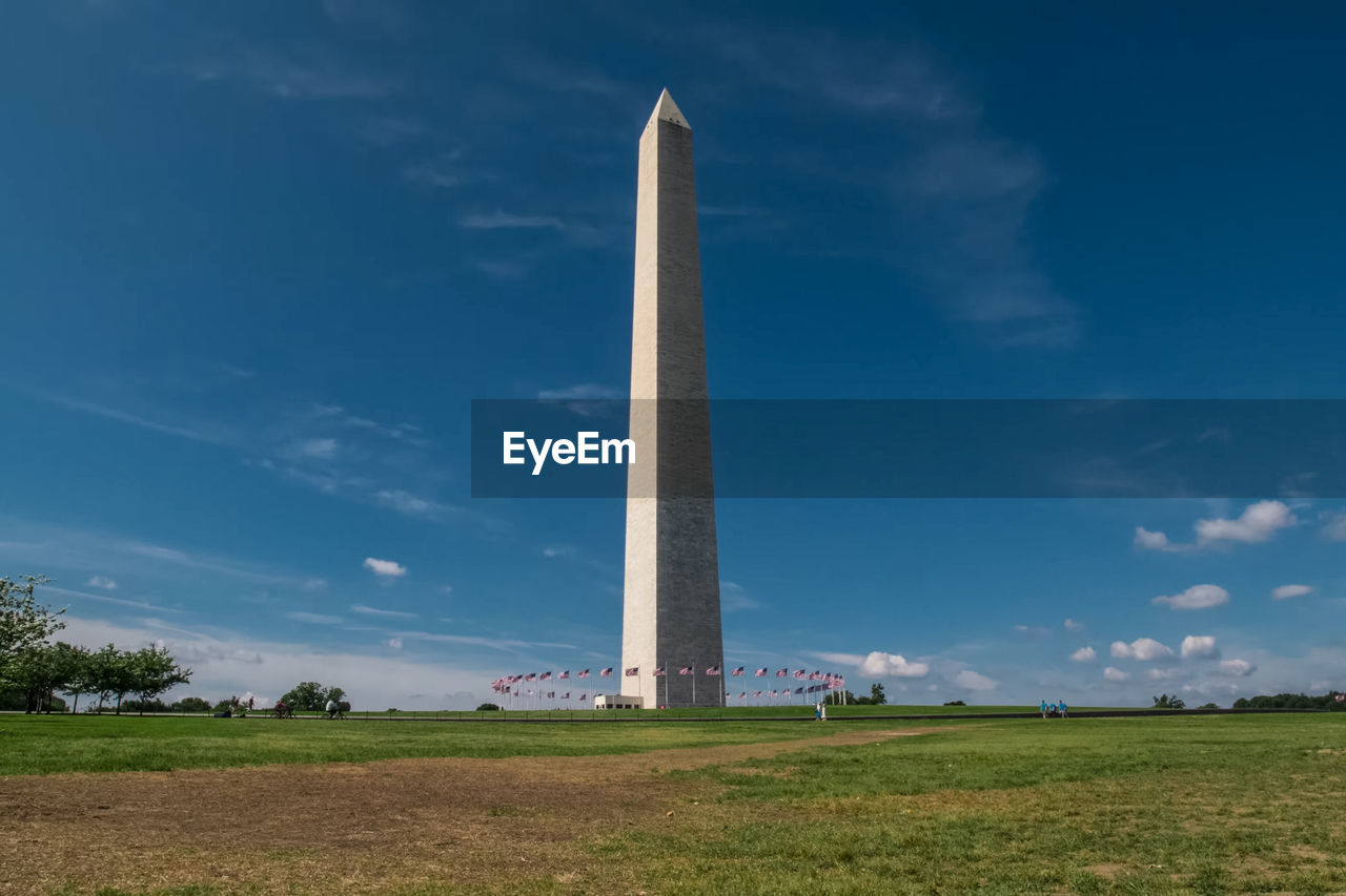 LOW ANGLE VIEW OF MONUMENT ON FIELD